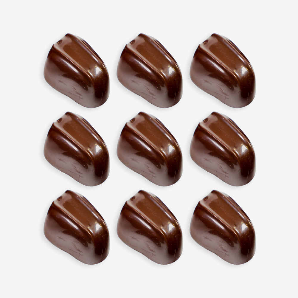 Nine chocolate candies arranged in a 3x3 grid on a white background