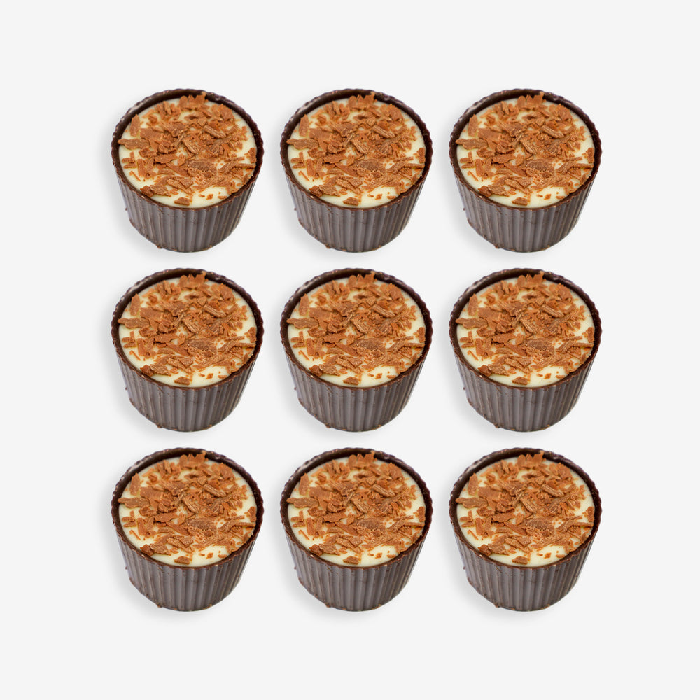 Nine cupcakes with a crumbly topping arranged in a 3x3 grid on a white background.