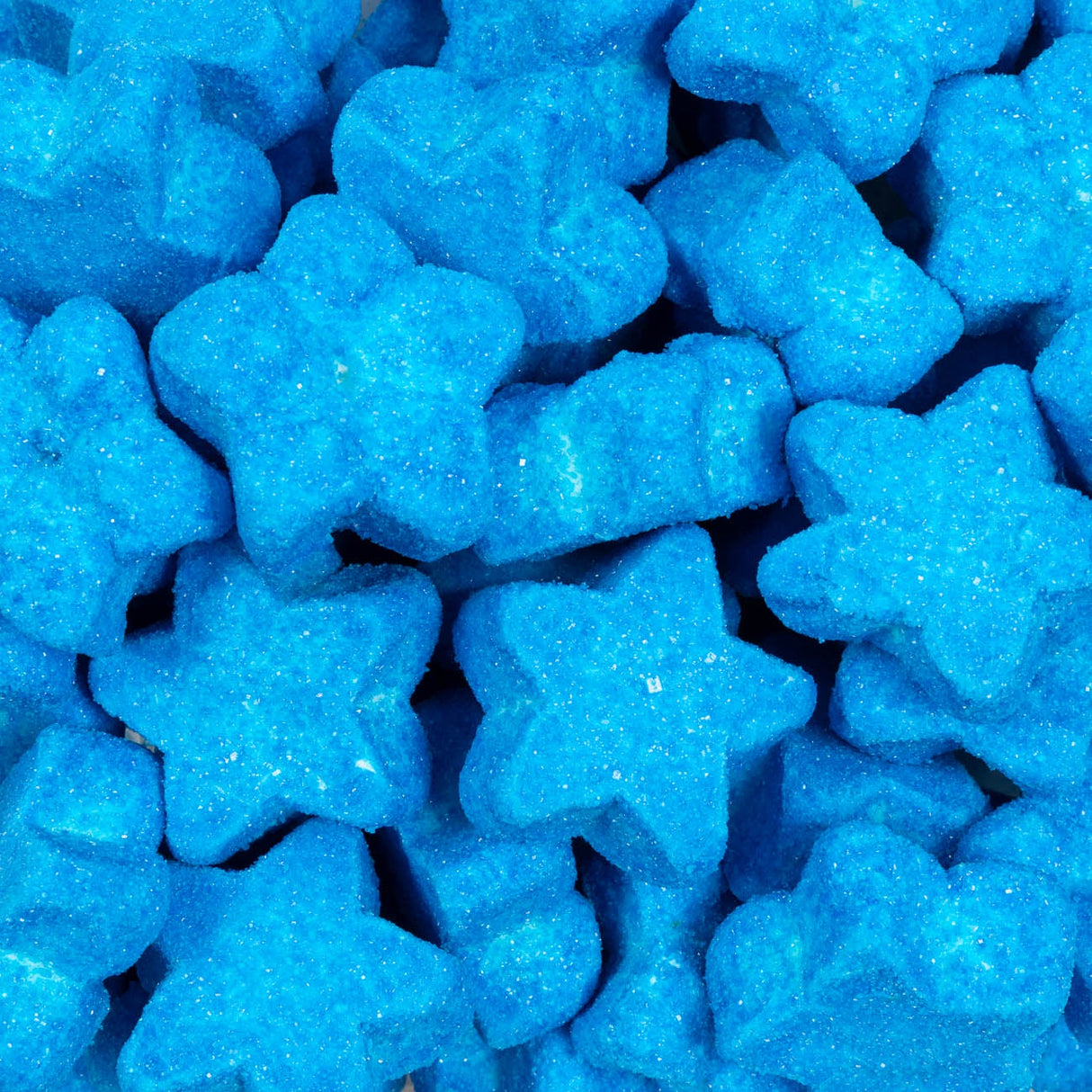 Blue star-shaped candies with glittery texture