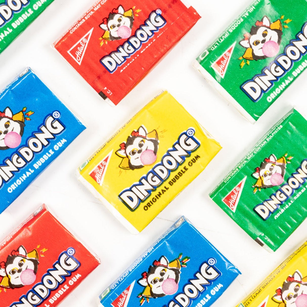 Multiple packages of Ding Dong bubble gum on a white background