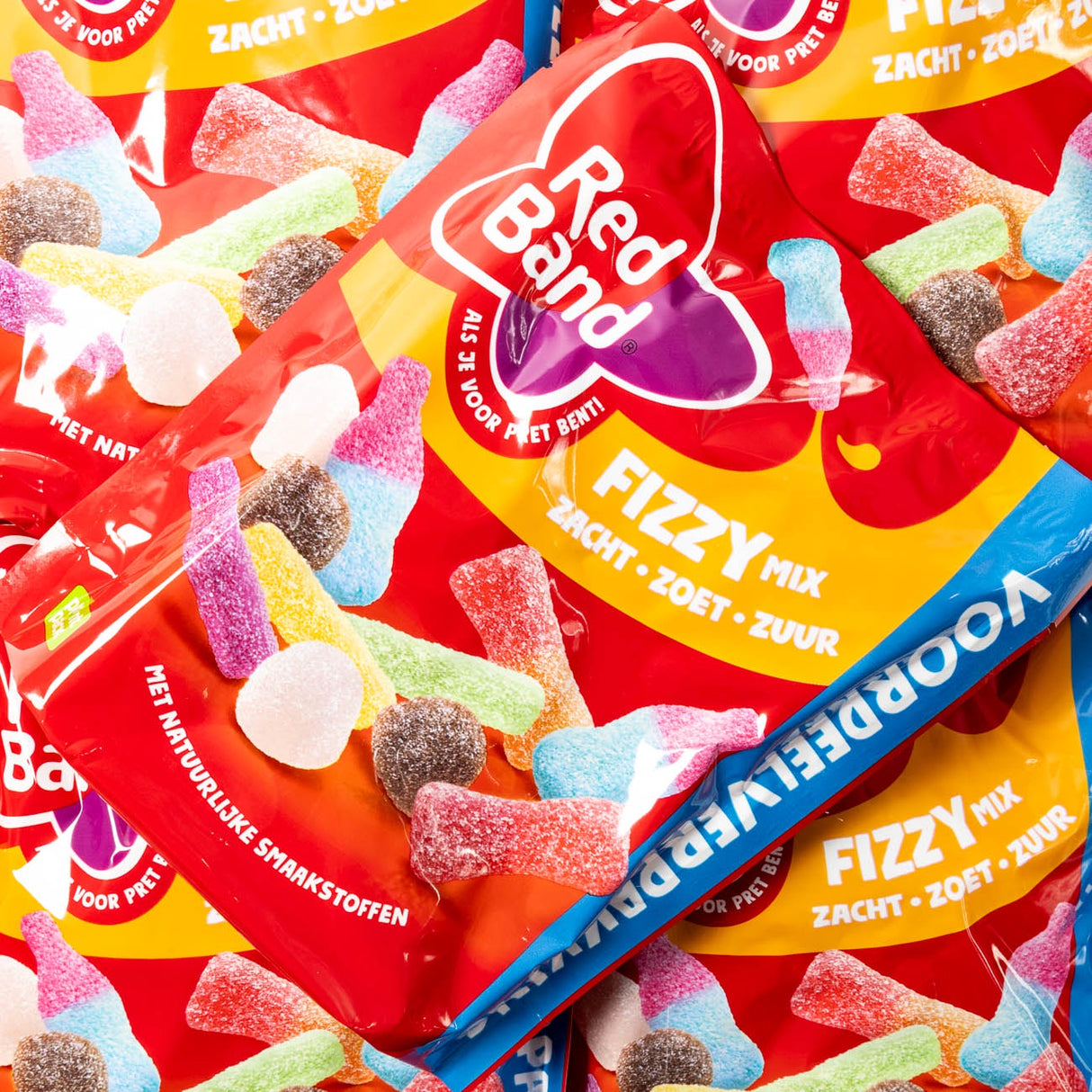 Red Band Fizzy Mix candy packages with colorful gummy candies on a red background
