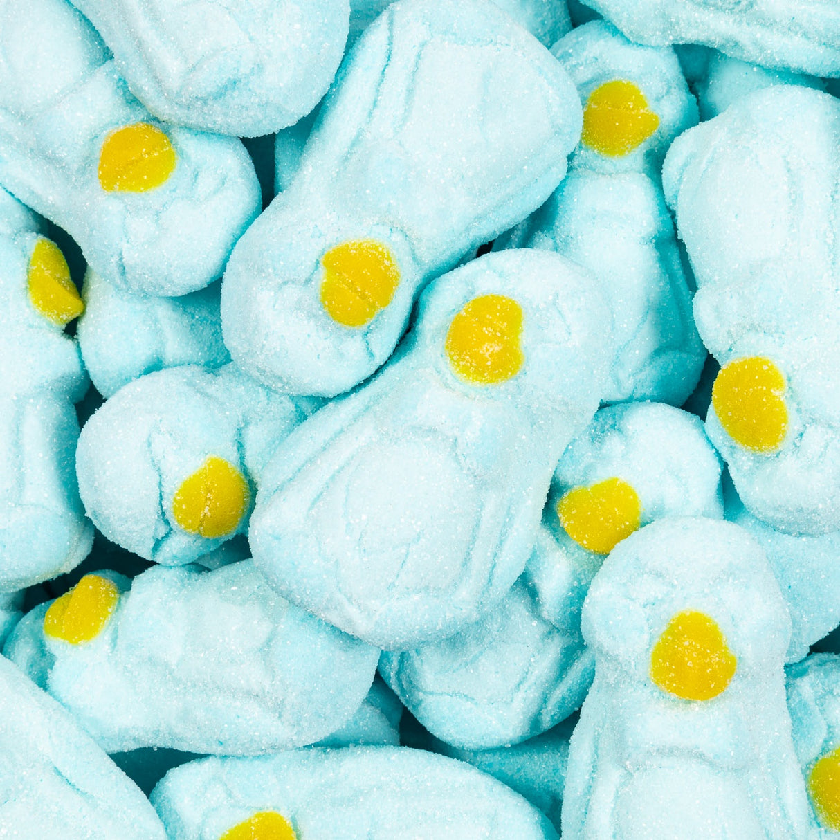 Close-up of blue marshmallow treats with yellow centers.