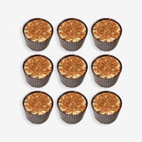 Nine cupcakes with a crumbly topping arranged in a 3x3 grid on a white background.